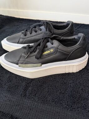 adidas Sleek Black Leather Platform Sneakers with White Platform and Gold Logo
